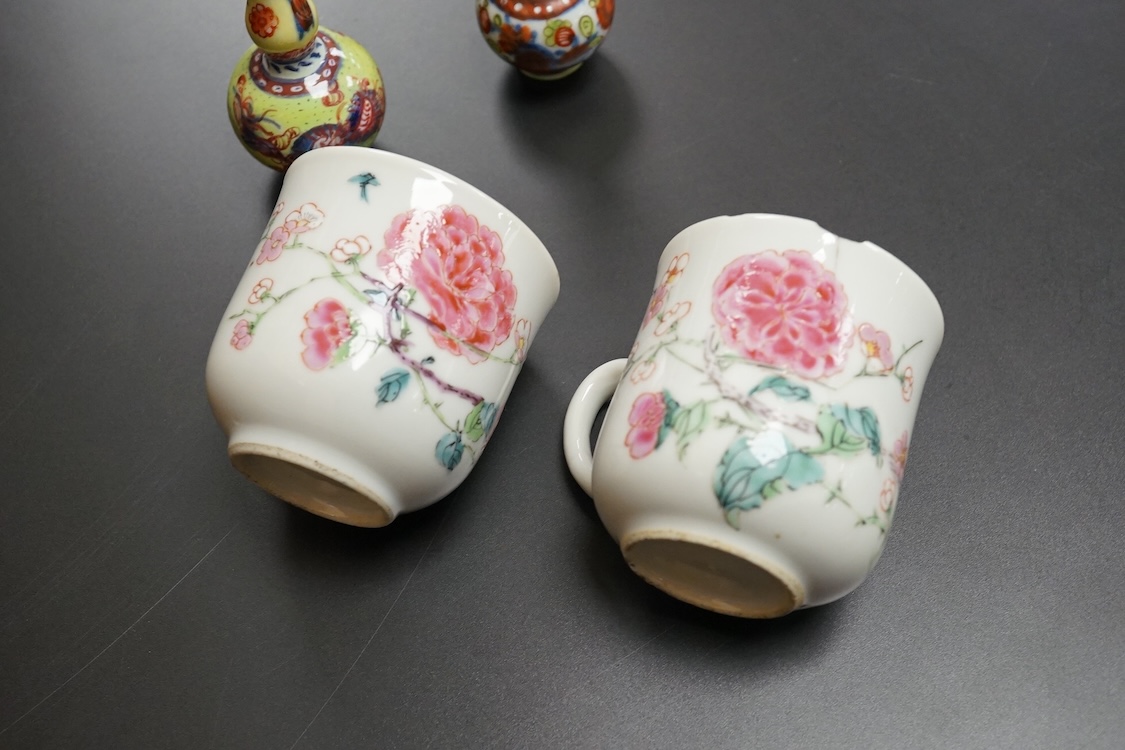 Two Chinese famille rose cups, Yongzheng period and two miniature clobbered vases, largest 6cm high